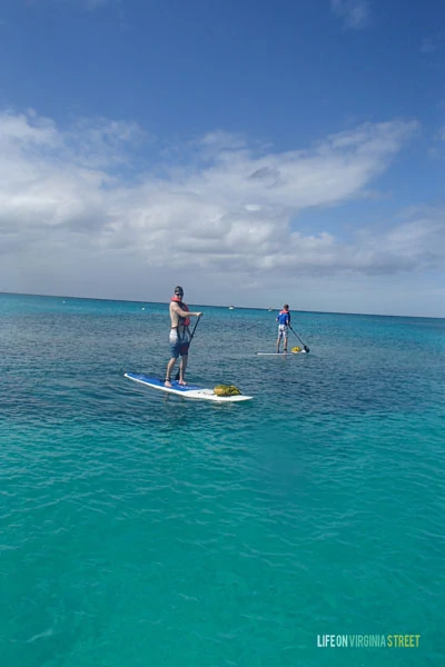 {My brother & husband paddle boarding in Turks & Caicos}