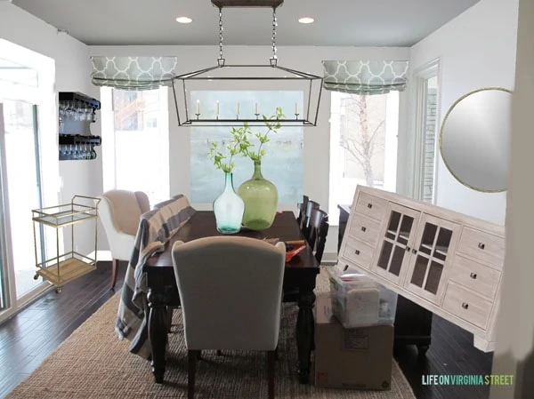 Dining room inspiration board with accents and round mirror planned. 