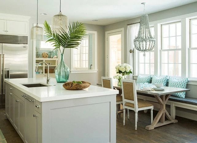 Decorating with Palm Fronds in the kitchen on the white kitchen island.
