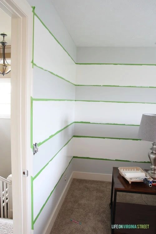 How To Achieve Perfectly Striped Walls - Details on How to Paint and a photo of my progress. This is after the first coat of paint went on.  - Life on Virginia Street