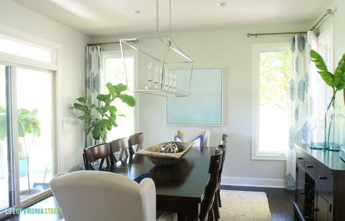 Stunning dining room makeover reveal using light, bright colors, whites and blues. 