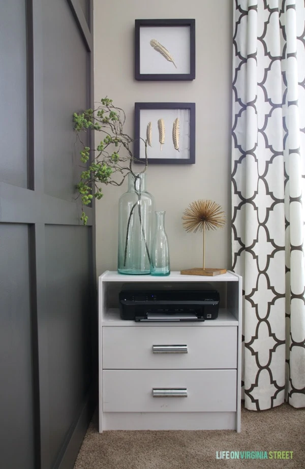 Ikea Rast side table with printer on it and glass vase on top.