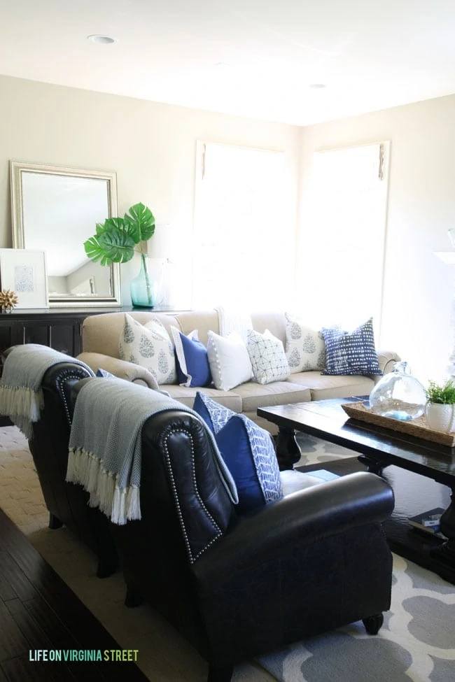 Neutral Living room with blue, green and white accents.