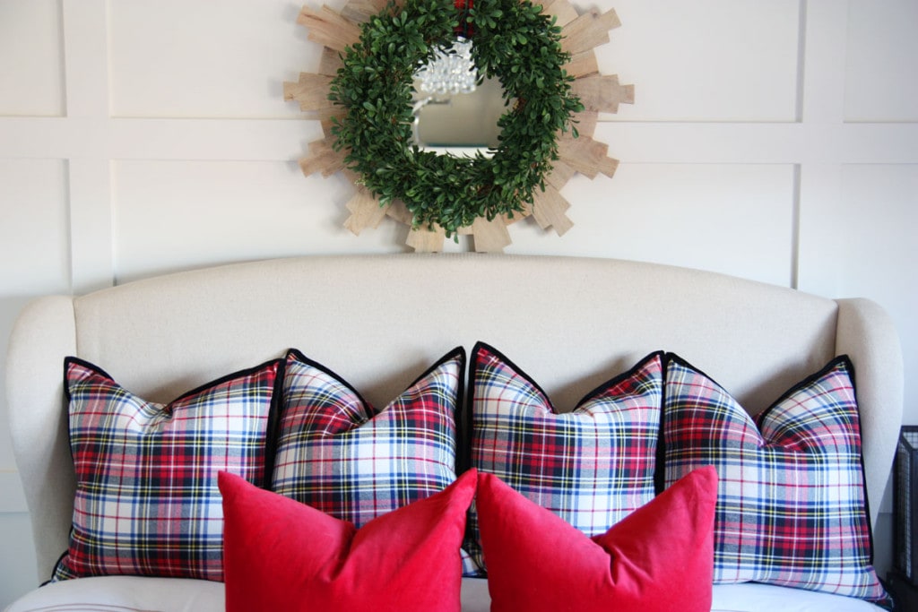 Plaid pillows on the bed.