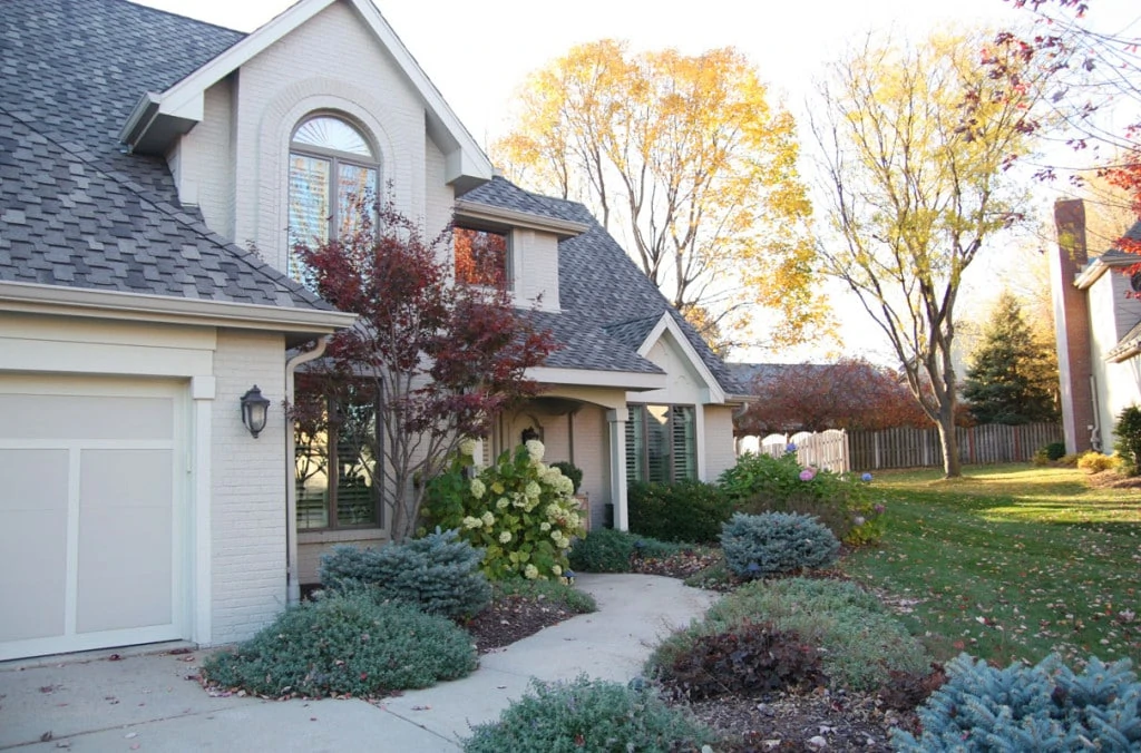 Omaha Home Exterior. You'd never know this home was built in the 80's. This gorgeous neutral exterior looks modern and brand new and looks stunning alongside these gorgeous fall colors. - Neutral Home Tour - Life On Virginia Street