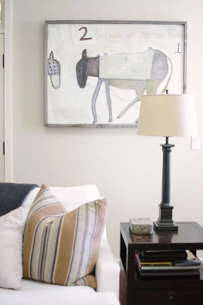 Living Room Art that matches the neutral color scheme of the room. Love this lamp and end table combo. - Neutral Home Tour - Life On Virginia Street