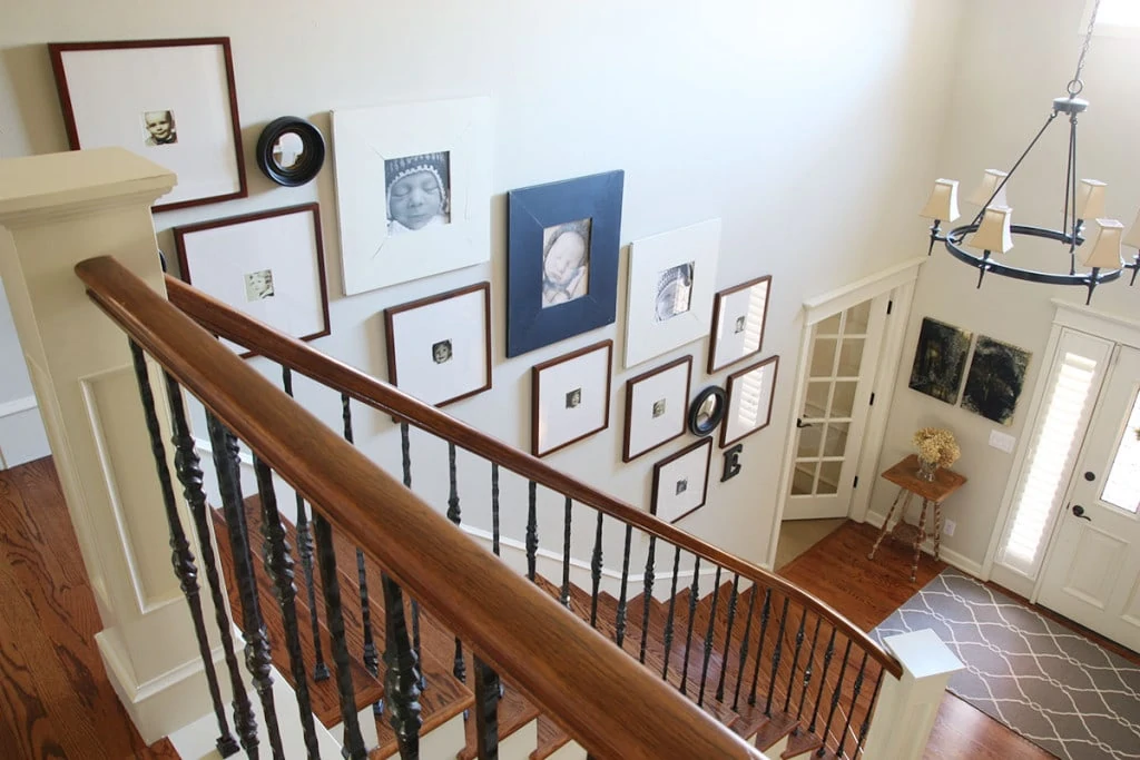 Staircase gallery frames, front entry way and gallery wall leading upstairs. - Neutral Home Tour - Life On Virginia Street