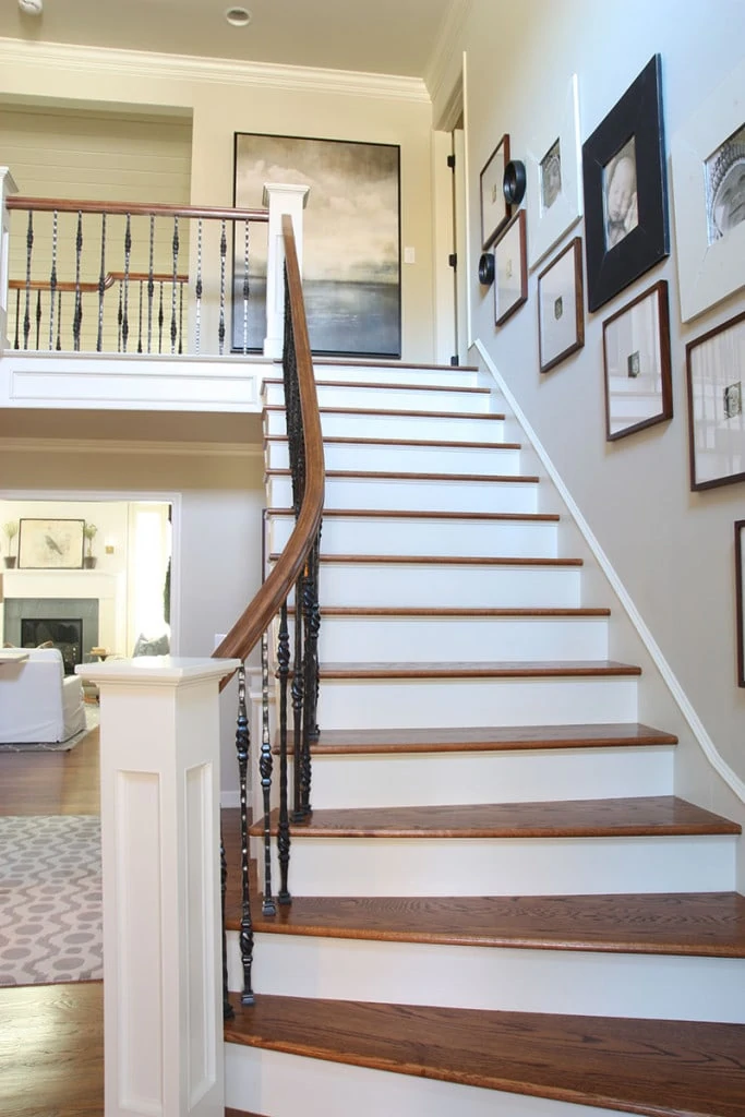 Staircase with a sleek, simplistic gallery wall. - Neutral Home Tour - Life On Virginia Street