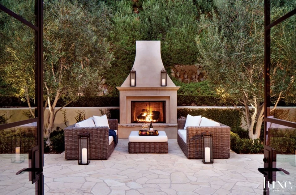 Outdoor Fireplace and Living Area via Luxe