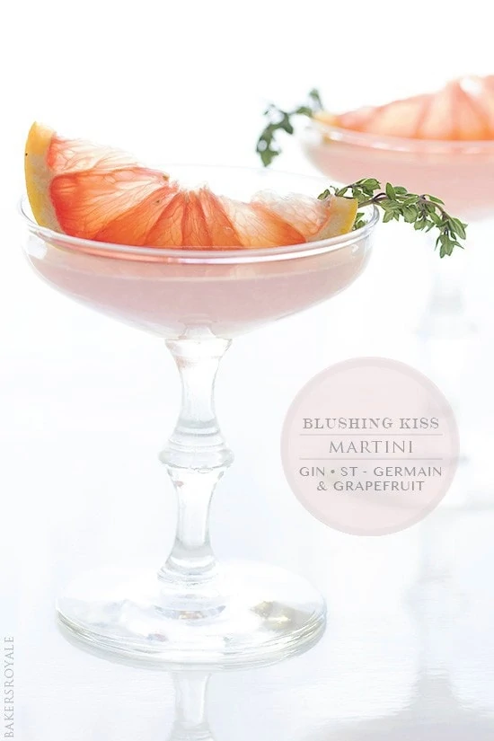 Blushing Kiss Martini with a large piece of grapefruit in the glass.