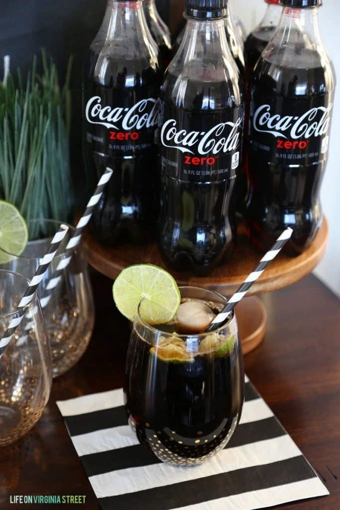 Coke Zero with Lime in a glass on the table.