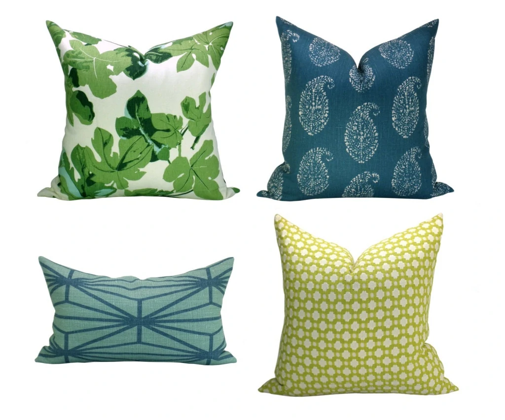 Pillows with fig leaves on them.
