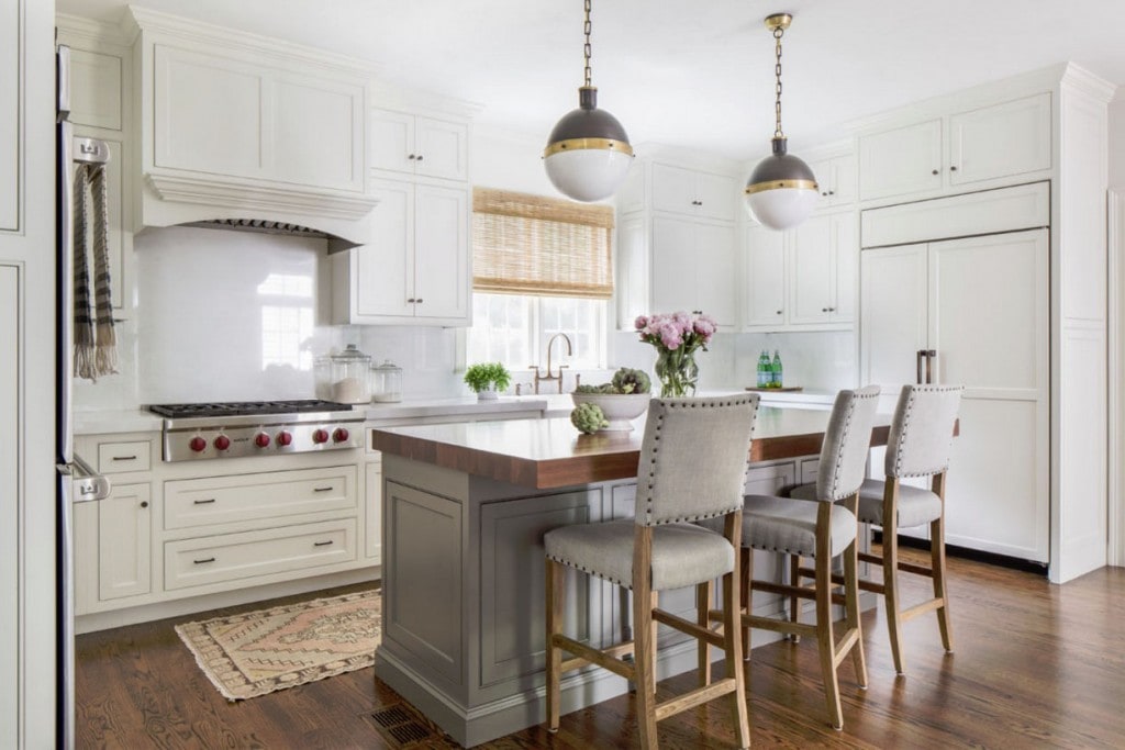 Kitchen with White Cabinets, Gray Island, Blush Pink Runner Rug, Bamboo Roman Shades, David Hicks Pendant Lights and Farmhouse Sink