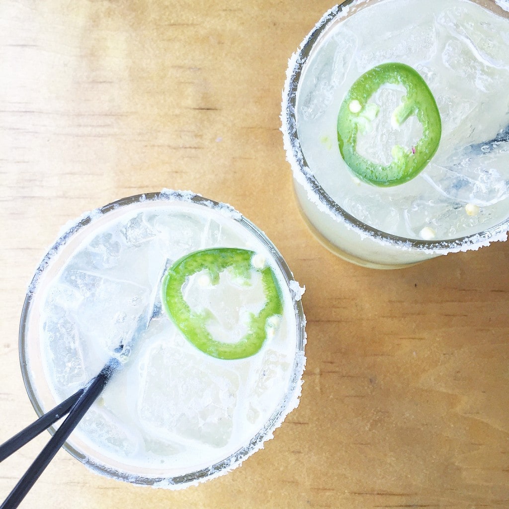 Jalapeno Lime Margarita in rimmed clear glasses.
