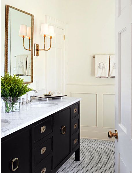 Powder Bath with Black Vanity and Marble Countertops