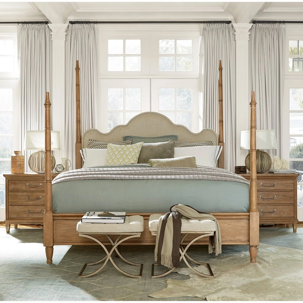 Universal Furniture Moderne Muse Maison Poster Bed with light coloured wood and soft grey bedding.