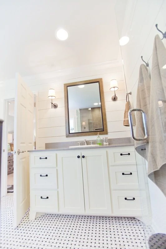 White Bathroom with Shiplap Walls and Tile Floor source unknown via
