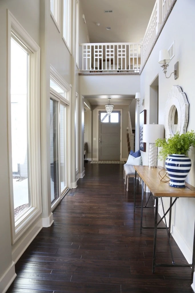 Dark wooden floor in entryway with small hallway lights.