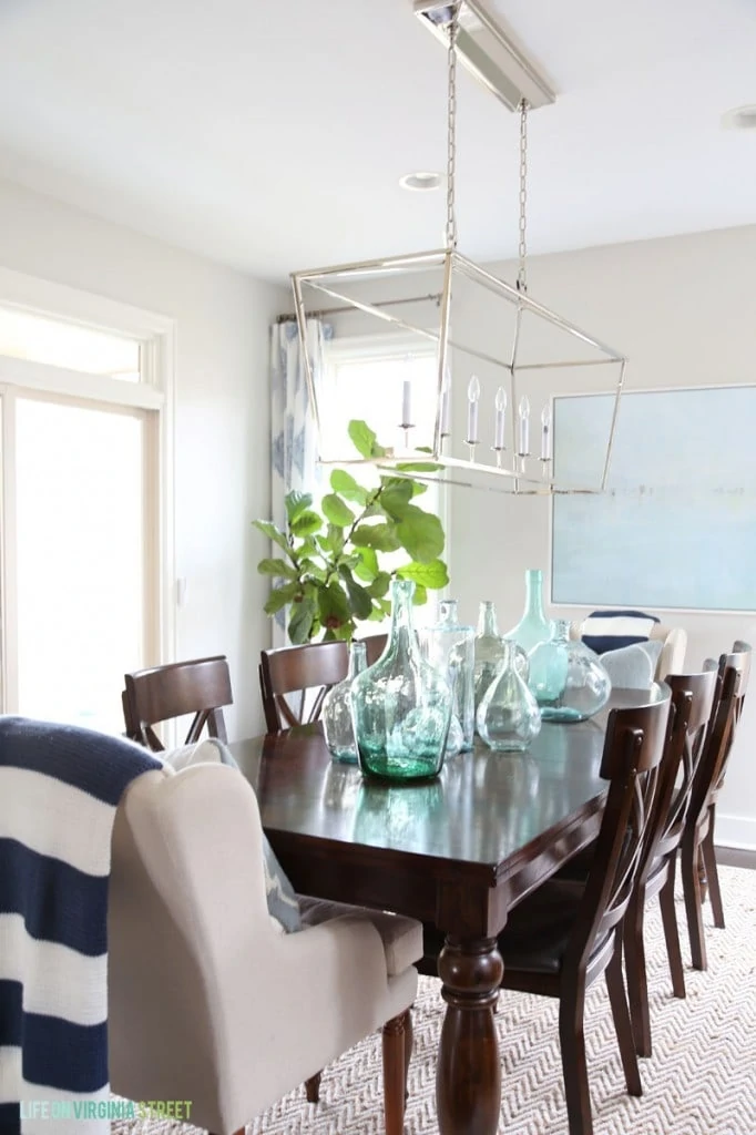Spring Dining Room with Navy Stripes and Glass Bottles via Life On Virginia Street