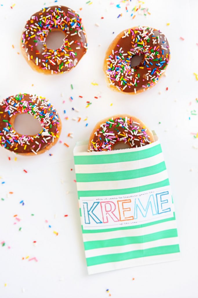A donut printable with chocolate icing and multi coloured sprinkles on the donuts.