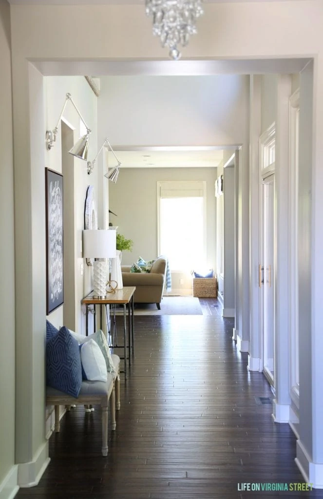 Entryway with Polished Nickel Swing Arm Sconces.