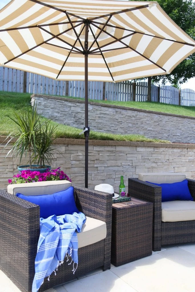 Bright blue pillows on outdoor chairs.