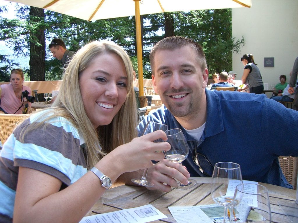 Kurtis and Sarah sharing a glass of wine.