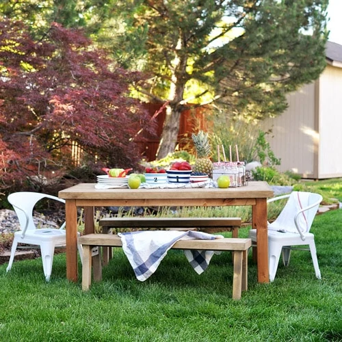 An outdoor picnic table set for eating.