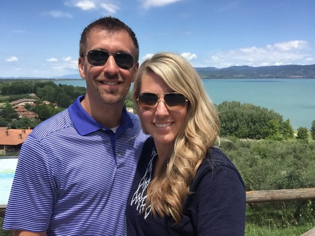 Posing in front of beautiful blue water.