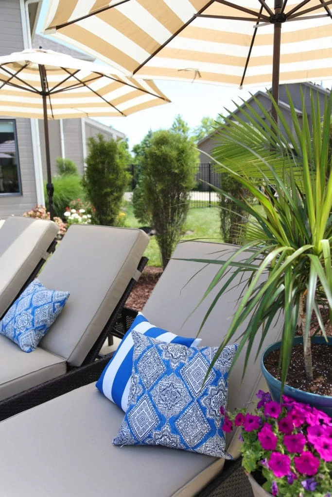 Serta Outdoor Collection Wicker Patio Chaise Lounge with Cushions in a Colorful Backyard via Life On Virginia Street