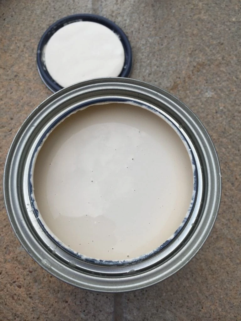 Country Chic Paint in Cheesecake with the lid off looking inside at the color.