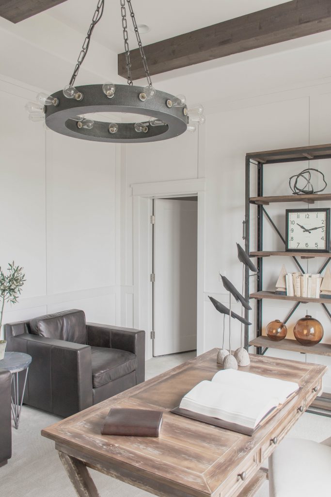 Neutral office with wood beams, white walls and wood and leather accents via Omaha Street of Dreams. Design by Pearson & Company. Image via Mandy McGregor Photography.