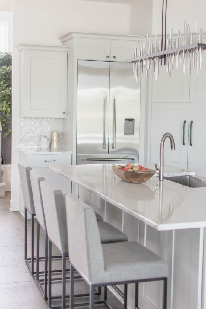 White and gray kitchen via Omaha Street of Dreams. Image via Mandy McGregor Photography.
