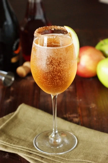 Sparkling apple cider in wine glass.