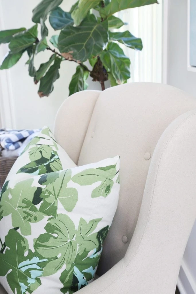 Fig leaf pillow on couch.