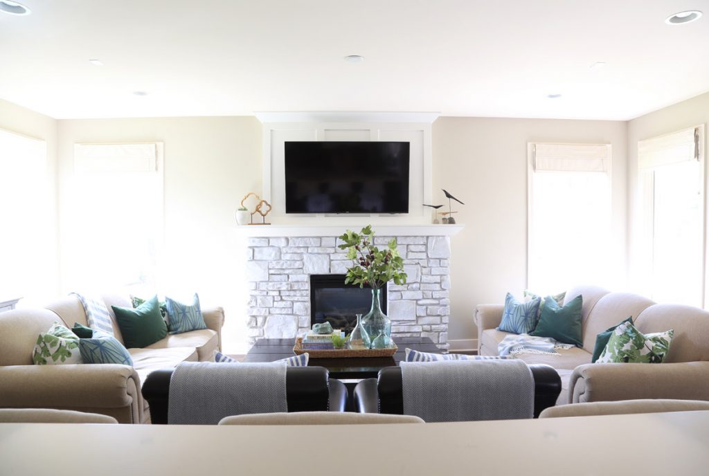 neutral-living-room-with-blue-and-green-accents-and-fig-leaf-pillows