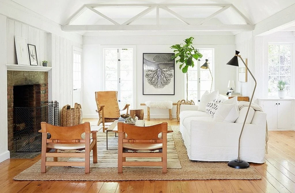 White home tour with leather and wood accents via Jenni Kayne