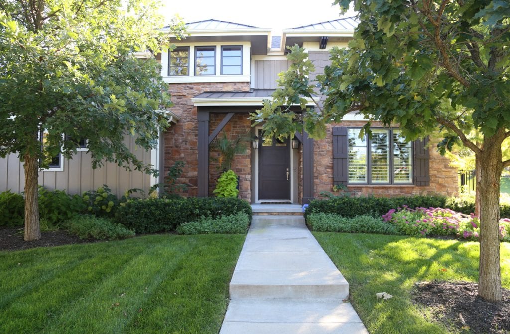 Porch Refresh and Home Exterior with a manicured lawn.