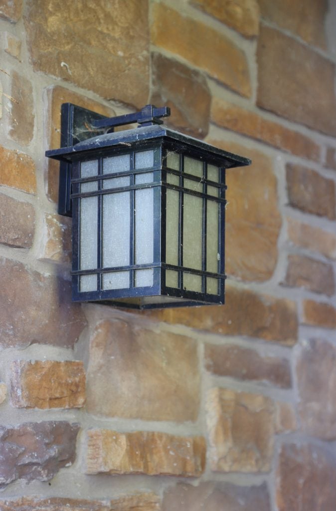 The old front porch light in a black metal.