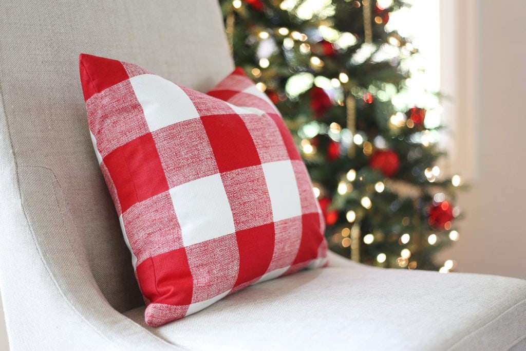 red-and-buffalo-check-pillow-in-a-christmas-dining-room-via-life-on-virginia-street