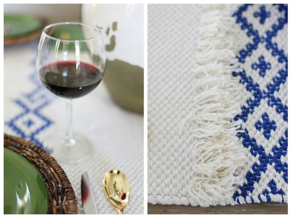 Up close picture of the red wine and blue and white table runner.