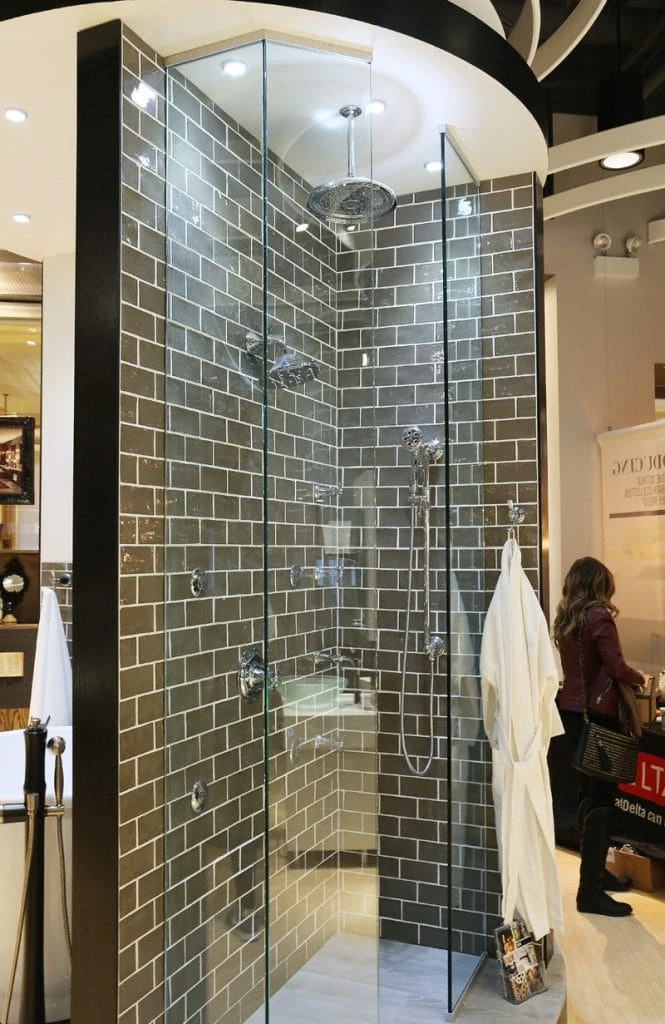 A shower stall in the showroom with the faucet ideas.