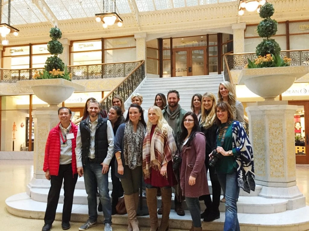 The group of bloggers at the foot the stairs posing for a picture.