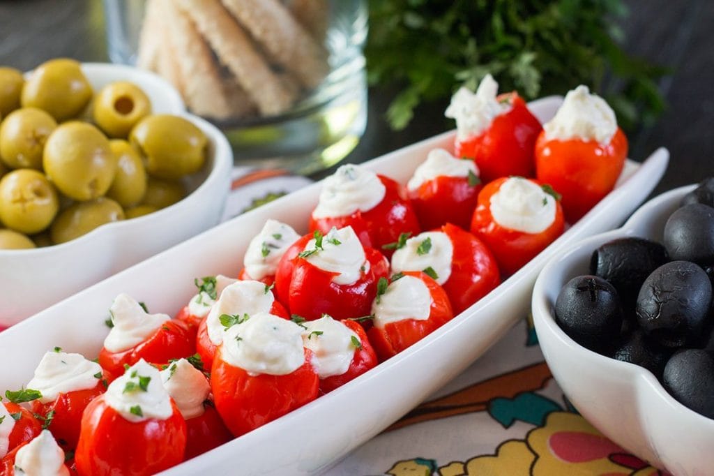 Stuffed pepper dews in a white long bowl.