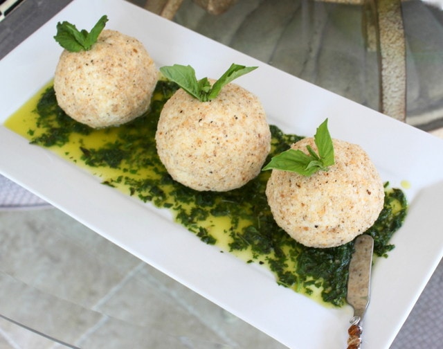 Parmesan goat cheese balls on a white tray.