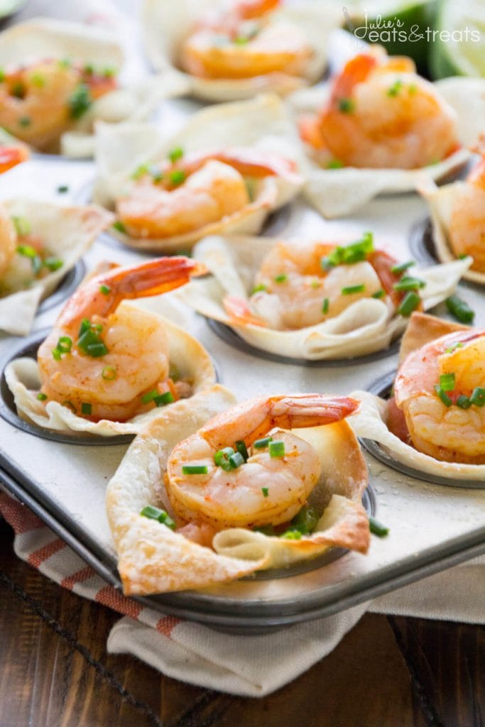 Individual shrimp bites on a baking tray.