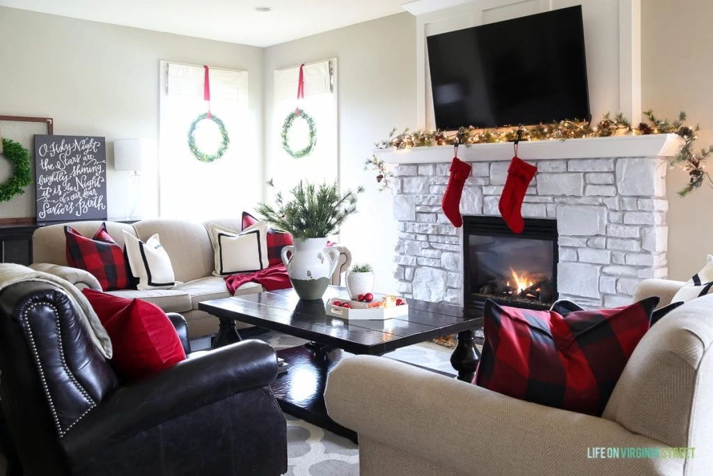 Red and black buffalo check Christmas living room. Love the O Holy Night artwork!