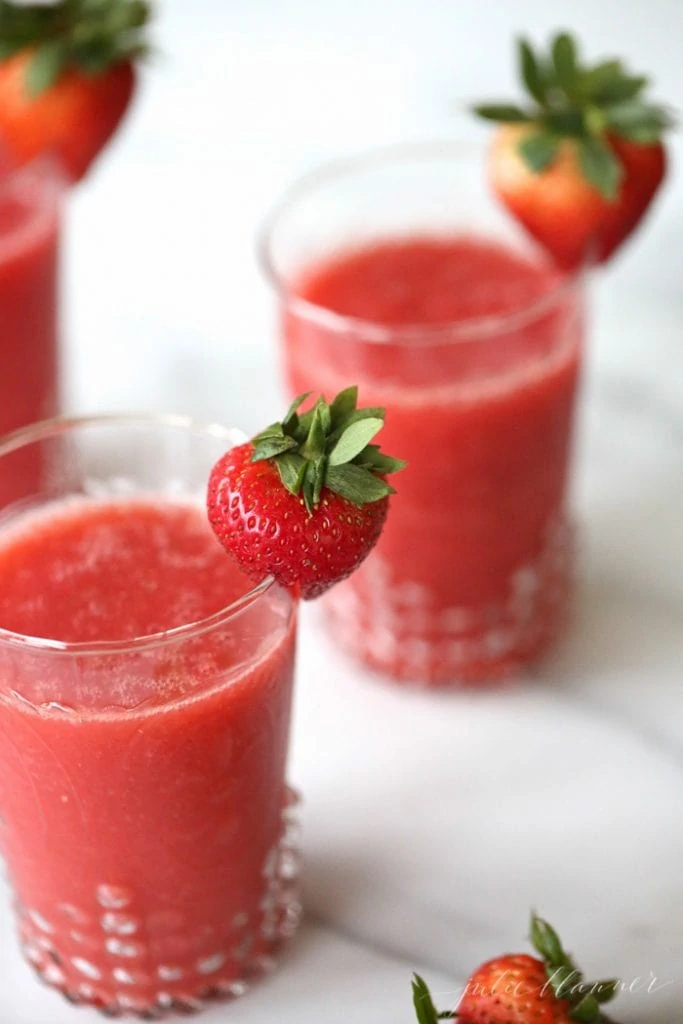 Champagne Slushies - They aren't just for hot summer days! The red color of these champagne slushies makes them the perfect Christmas Cocktail!