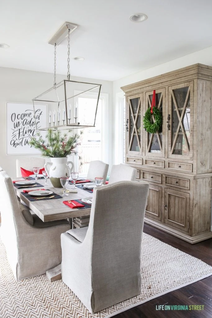 Plaid Christmas Tablescape in a neutral dining room with driftwood like finishes. Love the Darlana Linear Pendant and the Behr Silver Drop Walls!