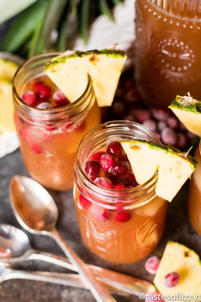 Cranberry Pineapple Iced Tea - Perfect for those moments when your house is overheating from too much cooking and too many guests! Cool down with this cranberry iced tea garnished with pineapple!